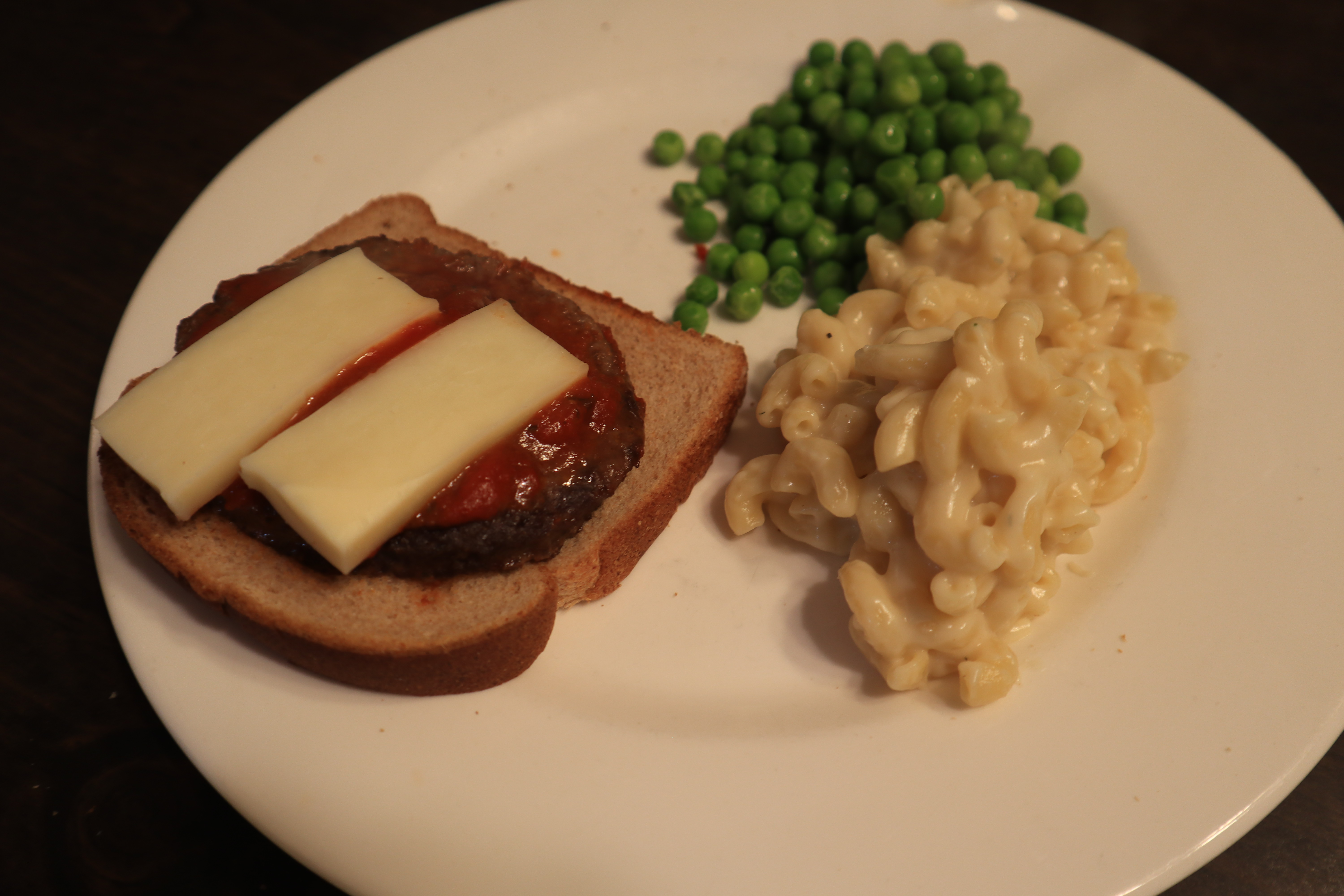Pizza Burgers for dinner with peas and mac & cheese!
